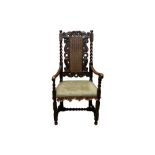 A CAROLEAN STYLE CARVED OPEN ARMCHAIR