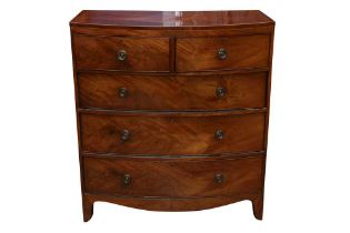 A GEORGE IV FLAME MAHOGANY BOW FRONTED CHEST