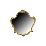 A GILTWOOD CARTOUCHE FORM WALL MIRROR