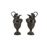 A PAIR OF PATINATED BRONZE EWERS, 19TH CENTURY