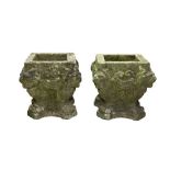 A PAIR OF RECONSTITUTED STONE GARDEN PLANTERS