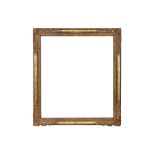 A BRITISH 20TH CENTURY CARVED AND GILDED LE BRUN STYLE FRAME