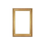 AN ENGLISH 19TH CENTURY CARVED AND GILDED COMPOSITION FRAME