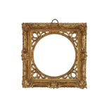 AN ENGLISH 18TH CENTURY CARVED, PIERCED AND GILDED SWEPT FRAME