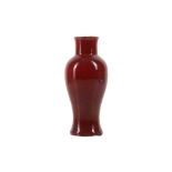 A CHINESE COPPER RED-GLAZED BALUSTER VASE.
