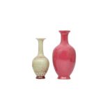A CHINESE PEACH BLOOM-GLAZED VASE AND A PINK-ENAMELLED VASE.