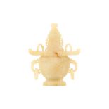 A CHINESE YELLOW JADE VASE AND COVER.