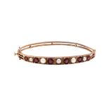 A GARNET AND PEARL BANGLE