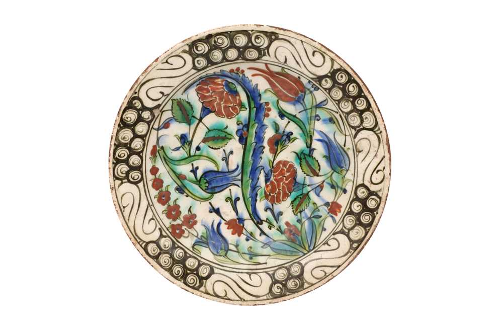 AN IZNIK DISH WITH FLORAL TRIUMPH Iznik, Ottoman Turkey, late 16th century