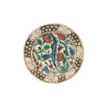 AN IZNIK DISH WITH FLORAL TRIUMPH Iznik, Ottoman Turkey, late 16th century