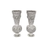 A PAIR OF CEREMONIAL REPOUSSÉ SILVER MINIATURE VASES Burma (Myanmar), late 19th - early 20th century