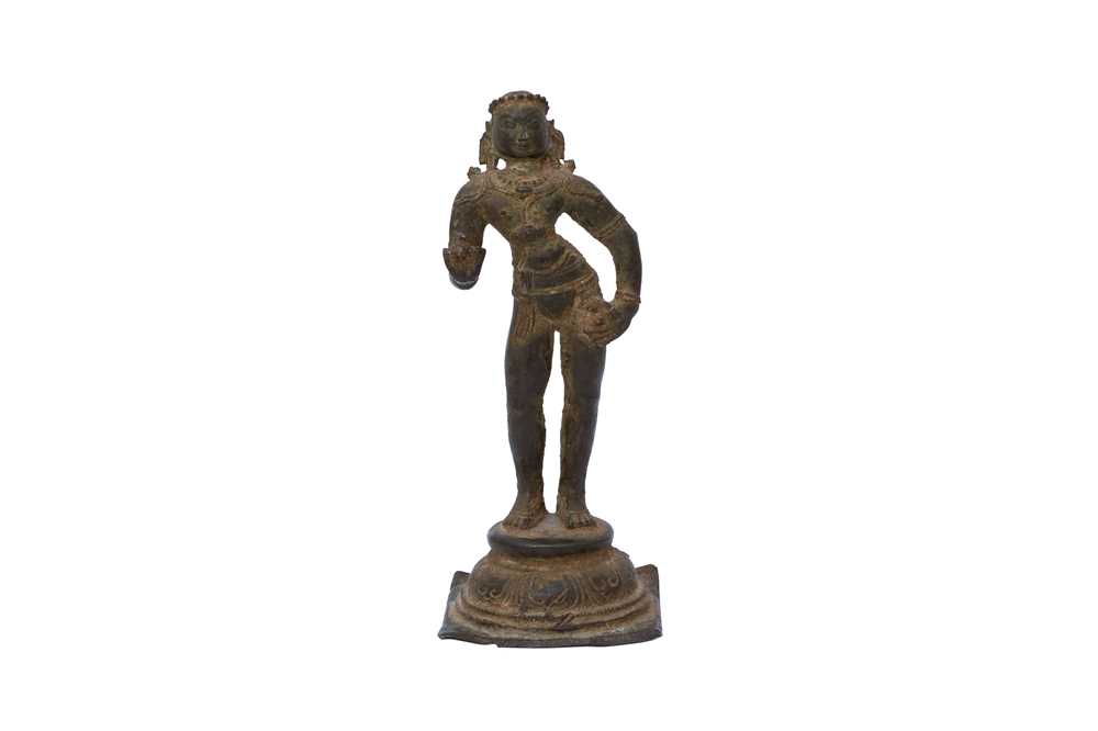 A BRONZE FIGURE OF A STANDING APSARA OR SOUTH INDIAN SAINT Possibly Tamil Nadu, Southern India, Chol