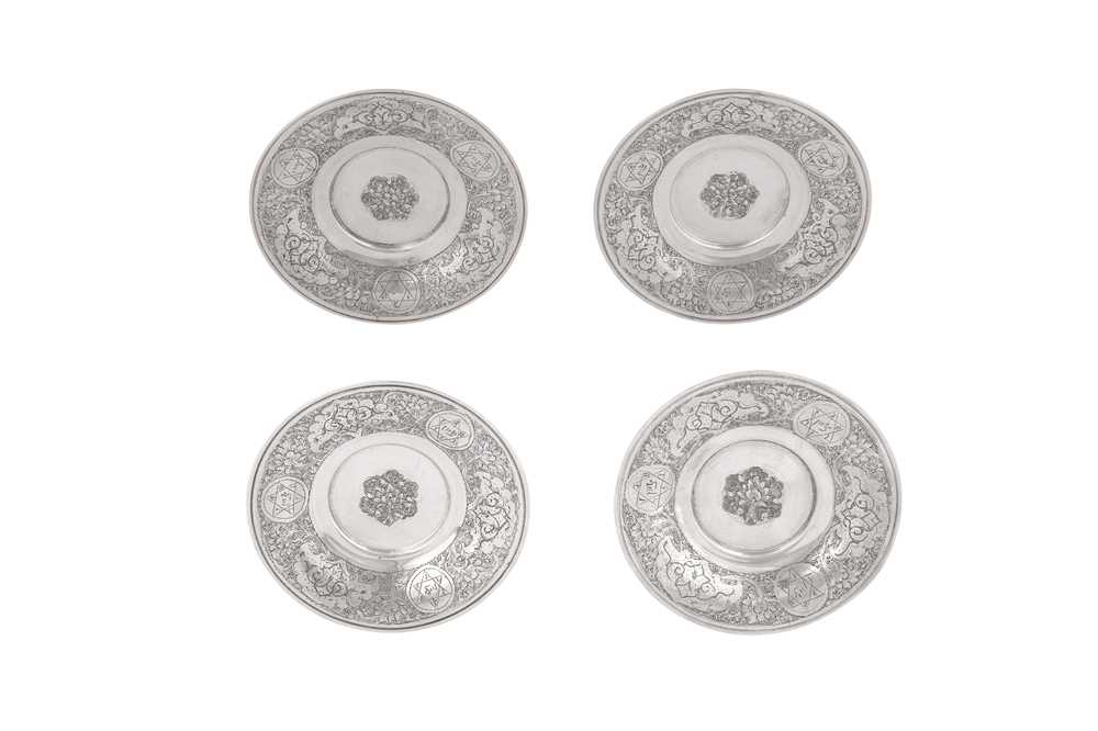 FOUR ENGRAVED SILVER SAUCERS Isfahan, Iran, first half 20th century
