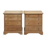 A NEAR PAIR OF ARTS & CRAFTS STYLE LIMED OAK BEDSIDE CHESTS
