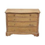 AN ARTS AND CRAFTS STYLE LIMED OAK SERPENTINE CHEST OF DRAWERS