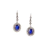 A PAIR OF SYNTHETIC SAPPHIRE AND DIAMOND CLUSTER PENDENT EARRINGS