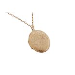 AN ENGRAVED GOLD LOCKET NECKLACE