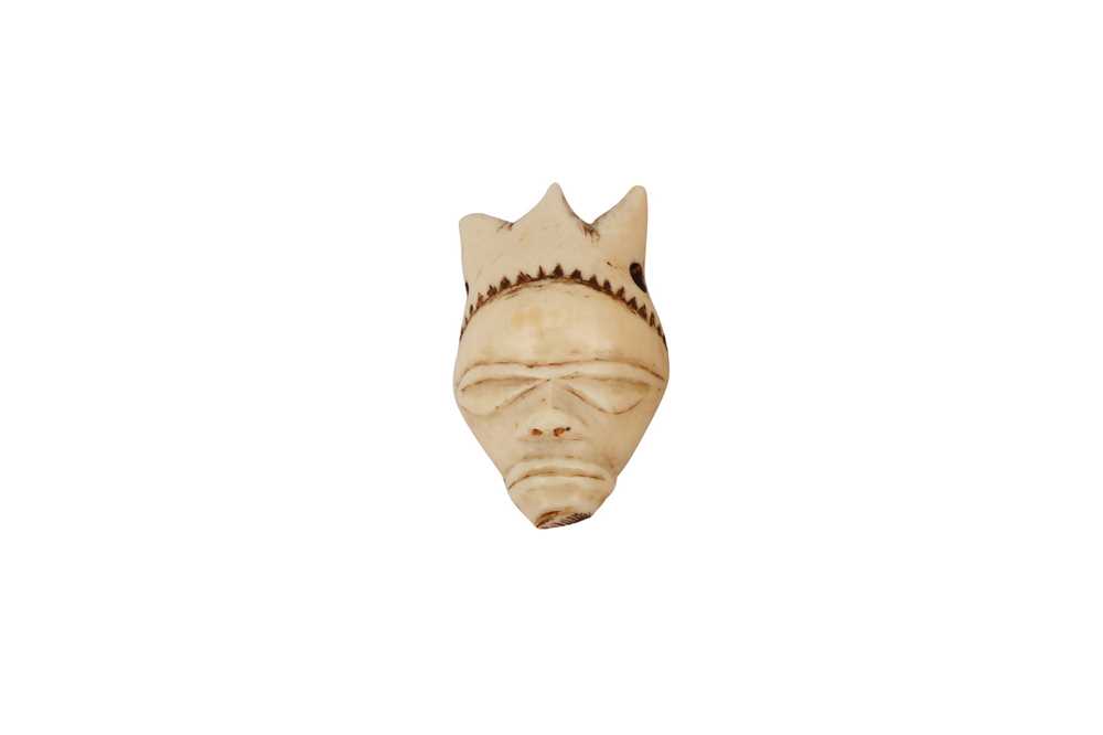 A CONGOLESE PENDE MASK PENDANT