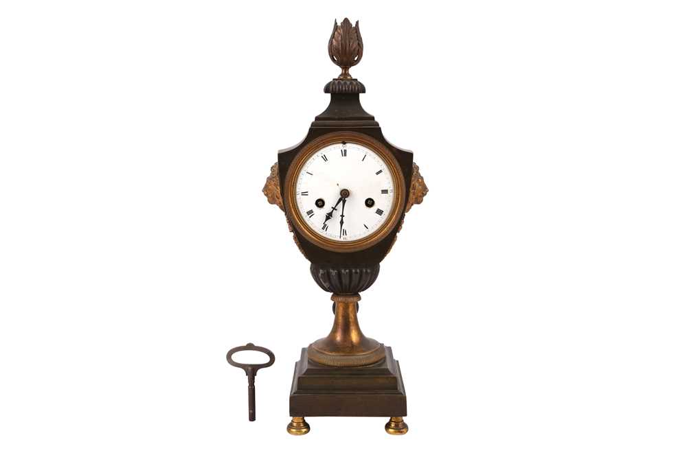 A FRENCH NEOCLASSICAL URN SHAPED BRONZE AND PARCEL GILT MANTEL CLOCK, 19TH CENTURY