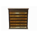 A MITCHELL’S SIX DRAWER WALL MOUNTED CIGARETTE DISPLAY CABINET