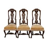 A SET OF THREE GEORGE I WALNUT AND FRUITWOOD SIDE CHAIRS