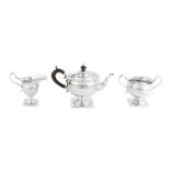 A George V sterling silver three-piece bachelor tea service, Birmingham 1910 by Williams Birmingham