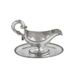 A mid- 19th century French 950 standard silver sauceboat on stand, the sauceboat Paris circa 1850 by