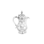 A George V ‘Arts and Crafts’ sterling silver hot water pot, London 1923 by Omar Ramsden (1873-1939)