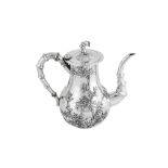 An early 20th century Chinese Export silver coffee pot, Canton circa 1910 retailed by Chong Woo of H