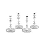 An important set of four George II sterling silver candlesticks, London 1743 by George Wickes (this