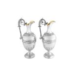 A pair of Victorian sterling silver wine ewers or claret jugs, Birmingham 1891 by Elkington and Co