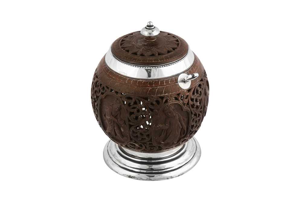 An early 20th century Indian Colonial silver mounted Burmese coconut honey pot, Madras circa 1910 by
