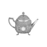 A Victorian Scottish sterling silver 'Burmese pattern' teapot, Edinburgh 1876 by Edwin Millidge and