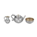 A Victorian sterling silver ‘aesthetic movement’ three-piece tea service, London 1883 by William and