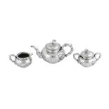 An early 20th century Chinese Export silver three-piece tea service, Shanghai circa 1910 retailed by