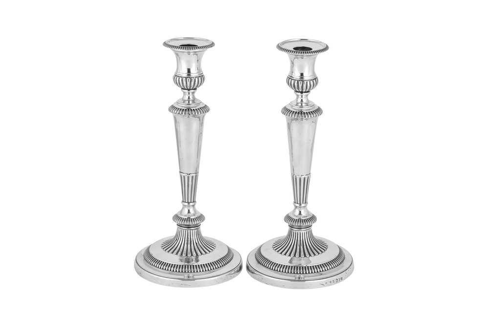 A pair of George III sterling silver candlesticks, Sheffield 1812 by John Roberts & Co