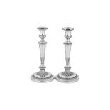 A pair of George III sterling silver candlesticks, Sheffield 1812 by John Roberts & Co