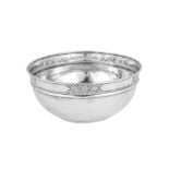 A George V 'Arts and Crafts' sterling silver bowl, Birmingham 1912 marked for Liberty and Co, design
