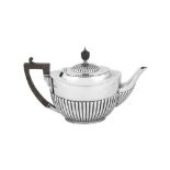 A George V sterling silver teapot, London 1910 by William Hutton and Sons