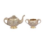 A late 19th century Anglo – Indian parcel gilt silver teapot and twin handled sugar bowl, Madras cir