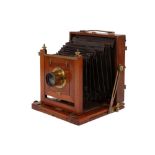 An Unmarked Half Plate Mahogany and Brass Field Camera