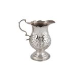 A GEORGE III STERLING SILVER CREAM OR MILK JUG, LONDON 1774 BY THOMAS ELLIS