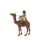 A COLD-PAINTED BRONZE FIGURE OF A NUBIAN BOY RIDING AN ARABIAN CAMEL (DROMEDARY) Germany, early to m