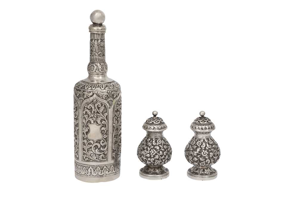 AN INDIAN SILVER TWO-PIECE CRUET SET AND A SCENT BOTTLE Kutch, Gujarat, West India, late 19th centur