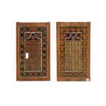 A PAIR OF IRANIAN STAINED GLASS WINDOW SHUTTERS IN WOODEN FRAMES Iran, the glass 1940s – 1960s, the