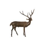 A LARGE PATINATED BRONZE SCULPTURE OF A STAG