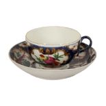 A WORCESTER FIRST PERIOD TEA BOWL AND SAUCER,