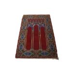 A HEREKE TRIPLE NICHE PRAYER RUG, TURKEY