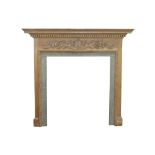 A CARVED PINE FIRE SURROUND