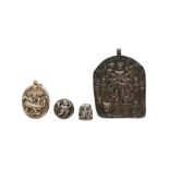 A MISCELLANEOUS GROUP OF THREE DEVOTIONAL PENDANTS AND A THIMBLE Southern India, 18th and 19th centu